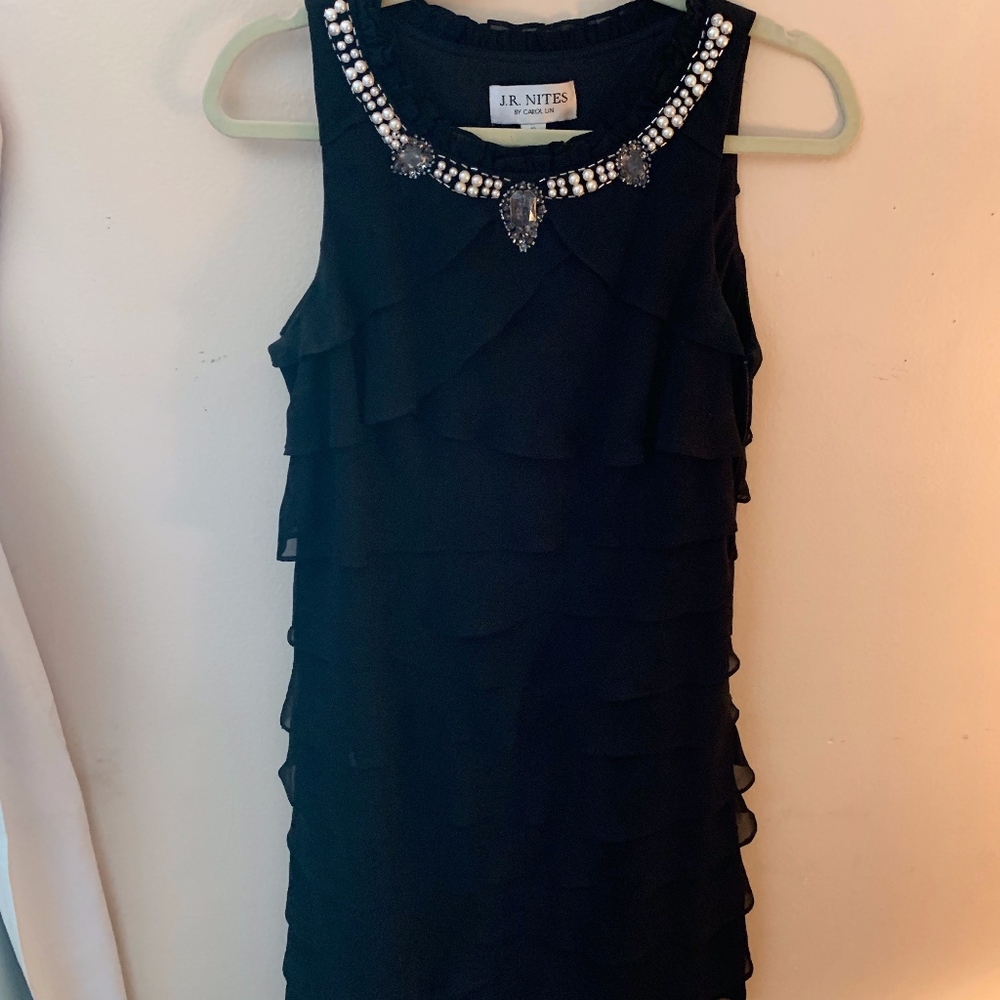 Classy black ruffled dress with pearl neckline